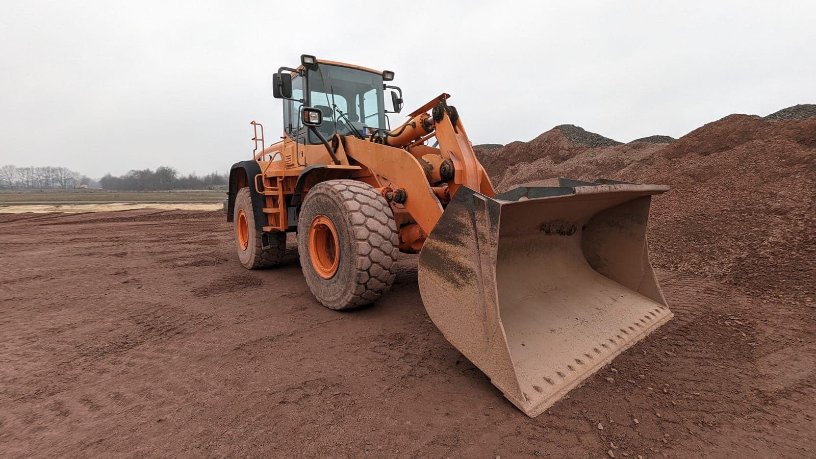 Wheel loader moving material on a job site